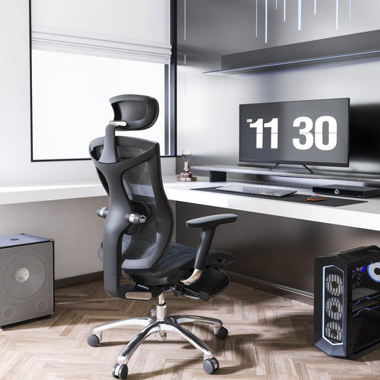 An ergonomic chair with built-in footrest positioned in a modern office setting, featuring a high-back design, aluminum armrests, and a mesh cover.